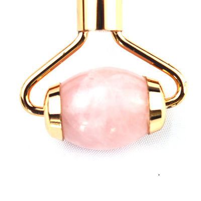 Gepersonaliseerd logo beschikbaar natuurlijke roze kwarts goud handvat gezichts jade roller roze kristal massager voor huid schoonheid behandeling