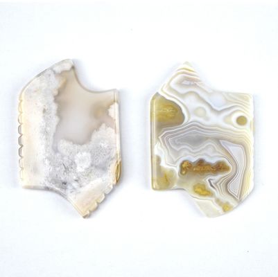 Lichaamsmassageapparatuur Eigenschappen Wit natuurlijke Guasha gezichtsmiddelen voor gezichtsspa met Sakura Agate Jade Gua Sha gezichtsmiddel