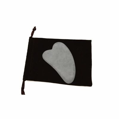 Handgereedschap Gua Sha gemaakt van witte jade voor effectieve spiermassage en schoonheidsverzorging