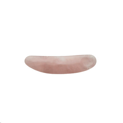 Verminder zwelling met gebogen cosmetische spatula en Mini Rose Quartz oogcrème applicator op gezicht Gua Sha massage stick