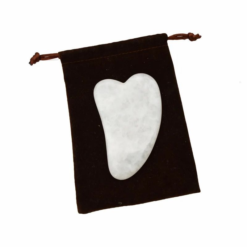Handgereedschap Gua Sha gemaakt van witte jade voor effectieve spiermassage en schoonheidsverzorging